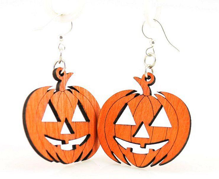 Pair of orange wooden jack-o-lantern dangle earrings on white