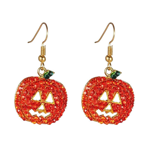 Pair of red-orange rhinestone jack-o-lantern dangle earrings with gold-tone hooks on a white background