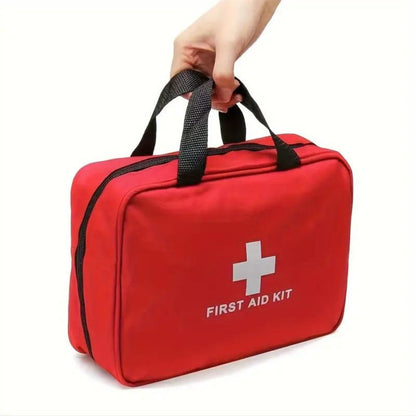 Hand carrying the red first aid kit bag