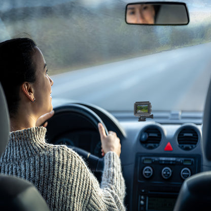 Action camera mounted on a car dashboard as a dash cam