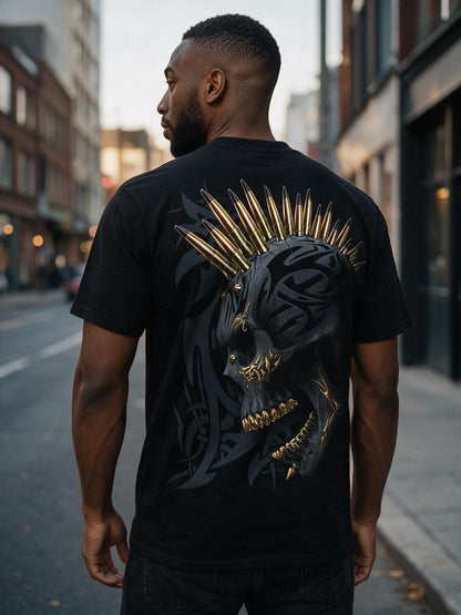 Back view of a man wearing the black and gold tribal skull graphic t-shirt on a city street