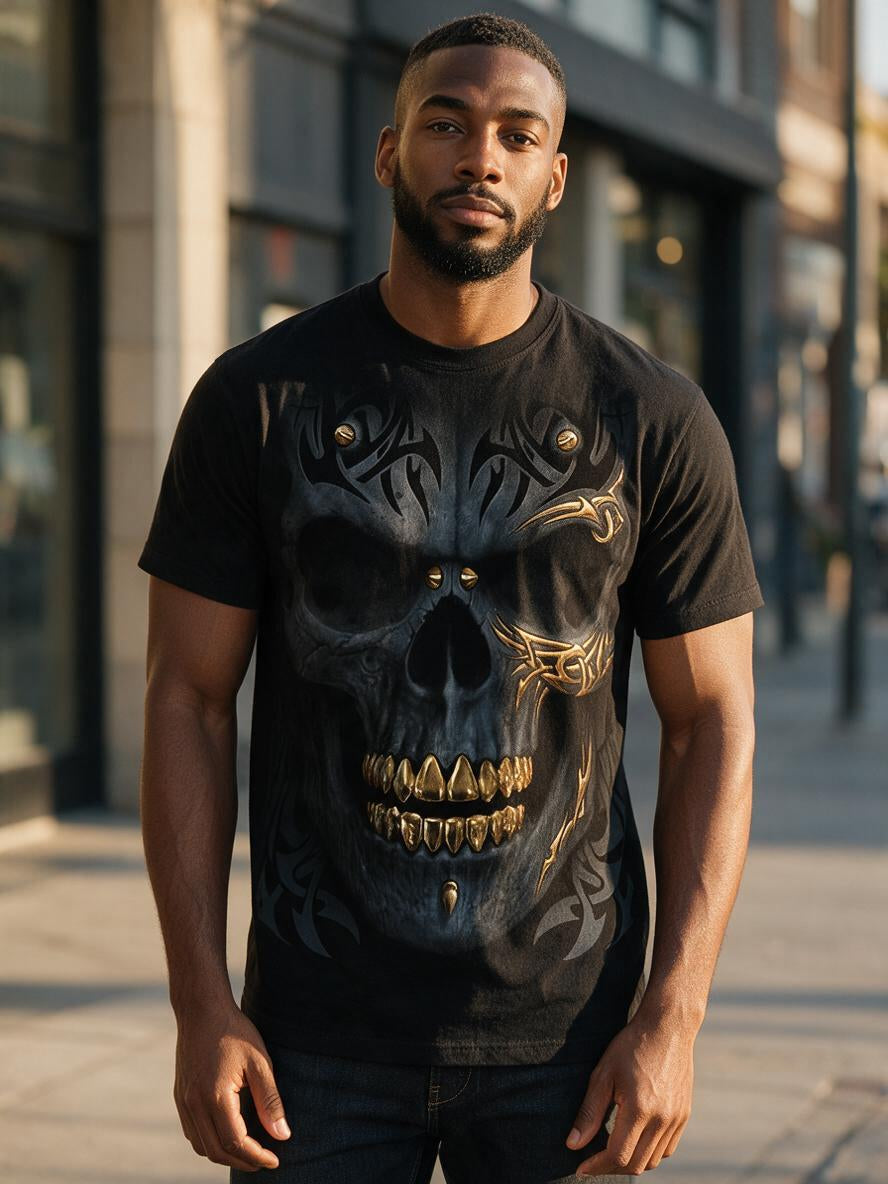 Front view of a man wearing the black tribal skull graphic tee with gold teeth print on a city street