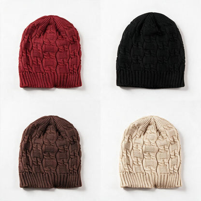 Cable knit slouchy beanies in red, black, coffee brown and beige on a white background