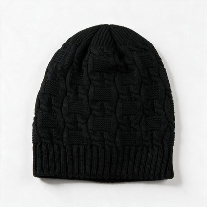Cable knit slouchy beanie in black on a white background