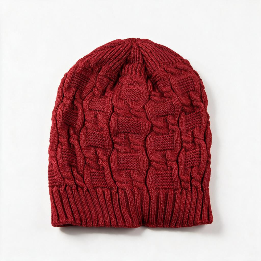 Cable knit slouchy beanie in jujube red on a white background