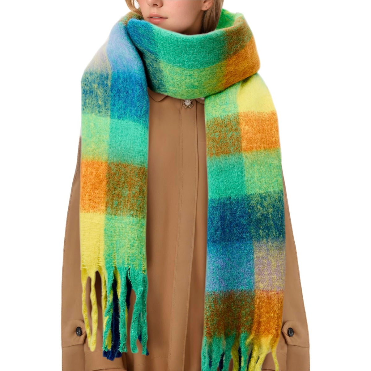 Rainbow plaid chunky blanket scarf with tassels worn over a camel coat