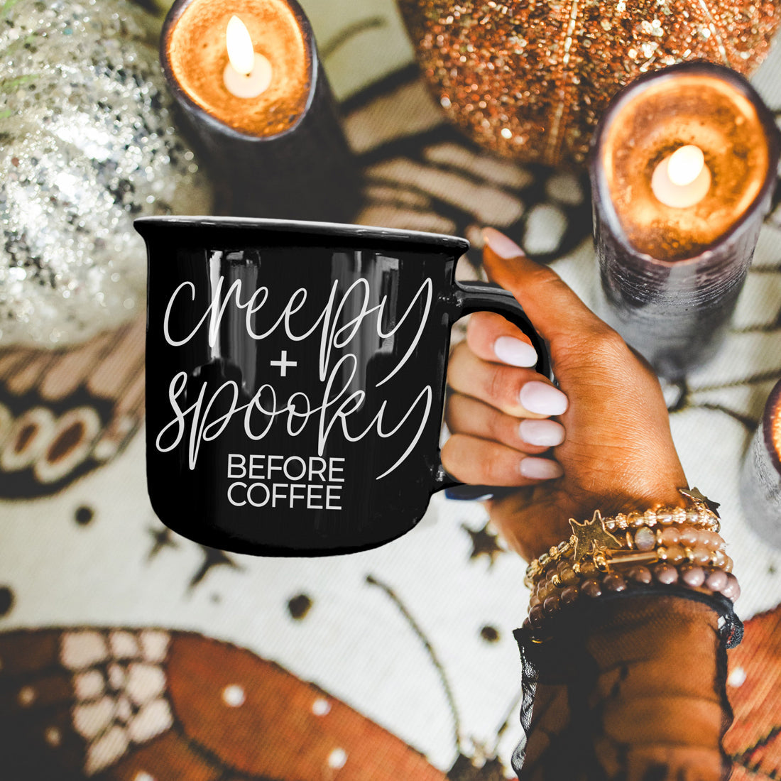 Creepy and Spooky mug held over a candlelit Halloween table