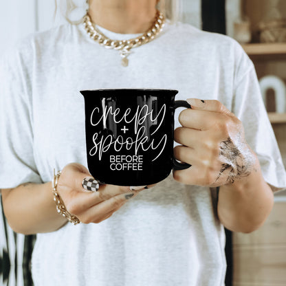 Woman in a white tee holding the Creepy and Spooky Before Coffee mug