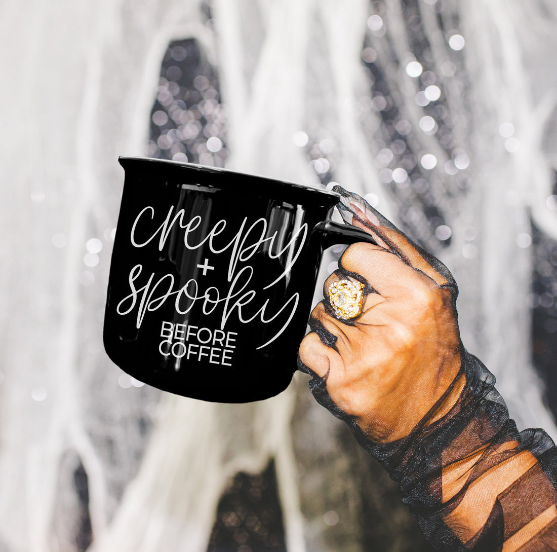 Black Creepy and Spooky mug held in a lace-gloved hand