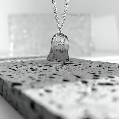 Close-up of the silver smiling ghost pendant