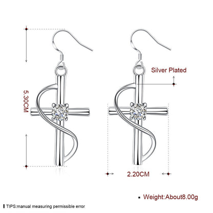 Elongated cross drop earrings in silver-tone with crystal center
