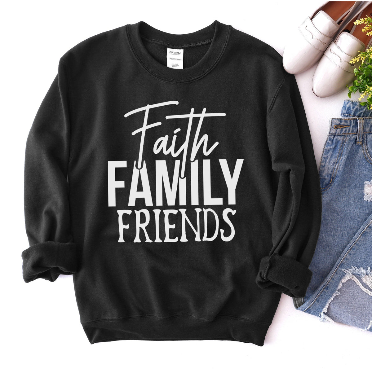 Black Faith Family Friends sweatshirt flat lay with jeans and loafers
