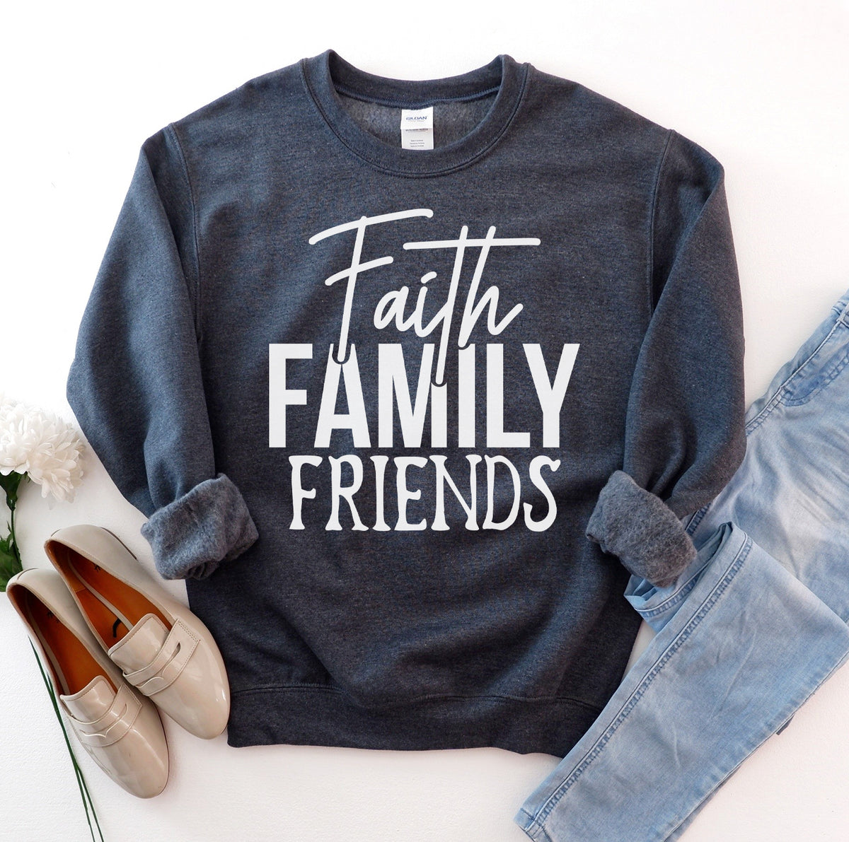 Dark gray Faith Family Friends sweatshirt flat lay with jeans
