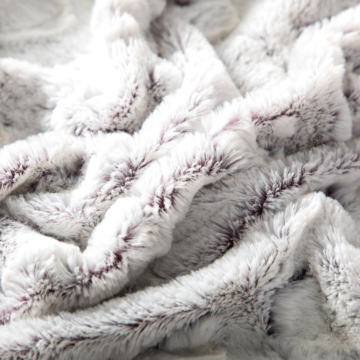 Close-up of the soft white faux fur with purple tips