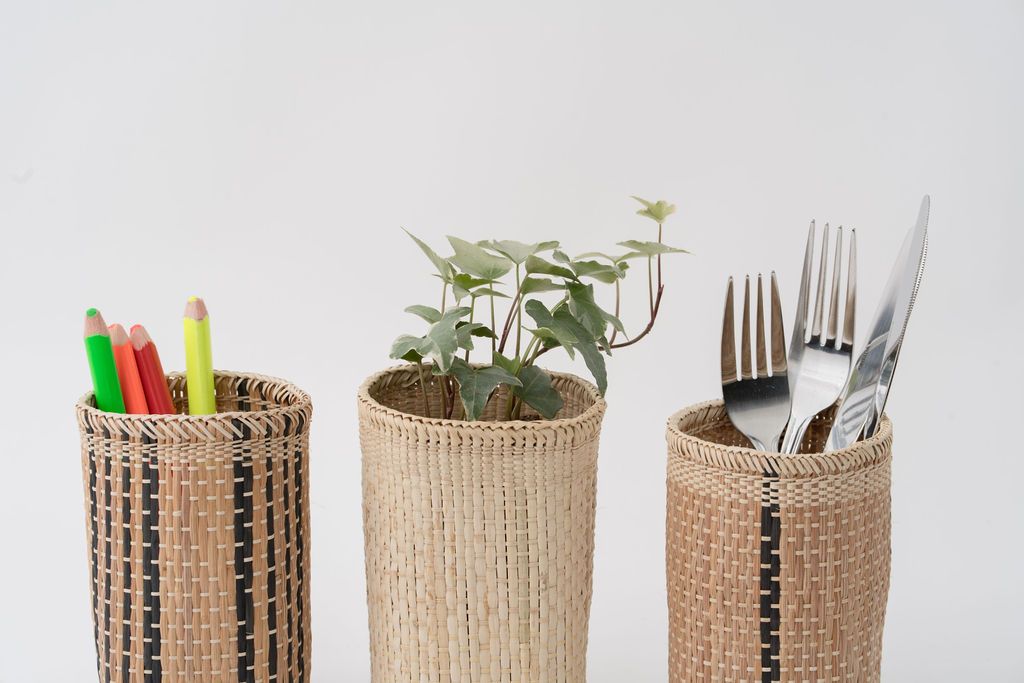 Close-up of handwoven fair trade baskets in natural and striped weaves