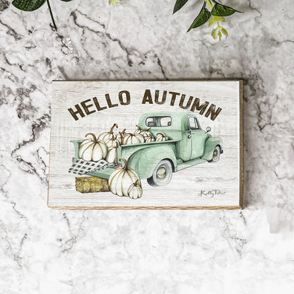 Hello Autumn teal truck sign on white marble with greenery
