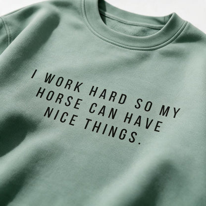 Close-up of the black I Work Hard So My Horse Can Have Nice Things print on the sweatshirt