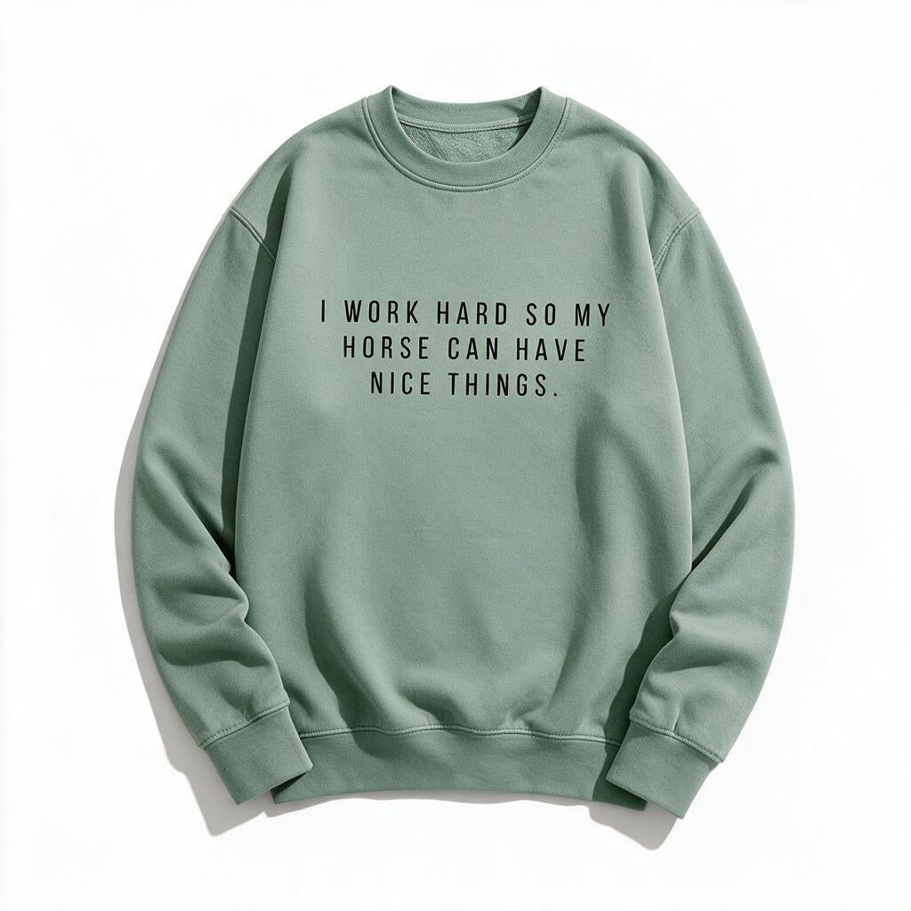 I Work Hard So My Horse Can Have Nice Things sweatshirt in sage light green, flat lay on white