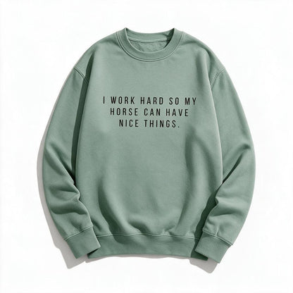 I Work Hard So My Horse Can Have Nice Things sweatshirt in sage light green, flat lay on white