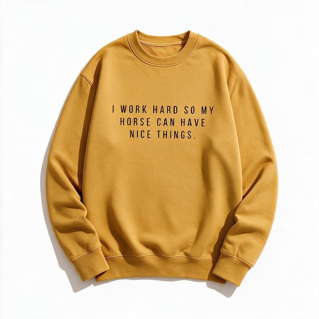 I Work Hard So My Horse Can Have Nice Things sweatshirt in mustard yellow, flat lay on white