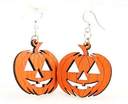 Pair of orange wooden jack-o-lantern dangle earrings on white