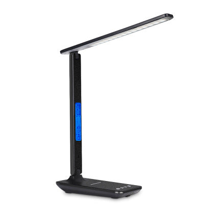 Black LED desk lamp with clock display, folded upright