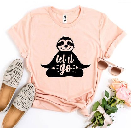 Peach Let It Go sloth t-shirt flat lay with loafers