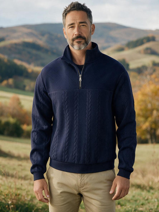 Man wearing the navy quarter-zip jacquard knit sweater in the autumn countryside