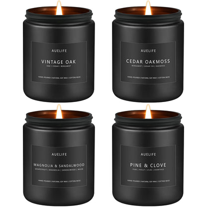 Four matte black soy candles on white: Vintage Oak, Cedar Oakmoss, Magnolia & Sandalwood and Pine & Clove