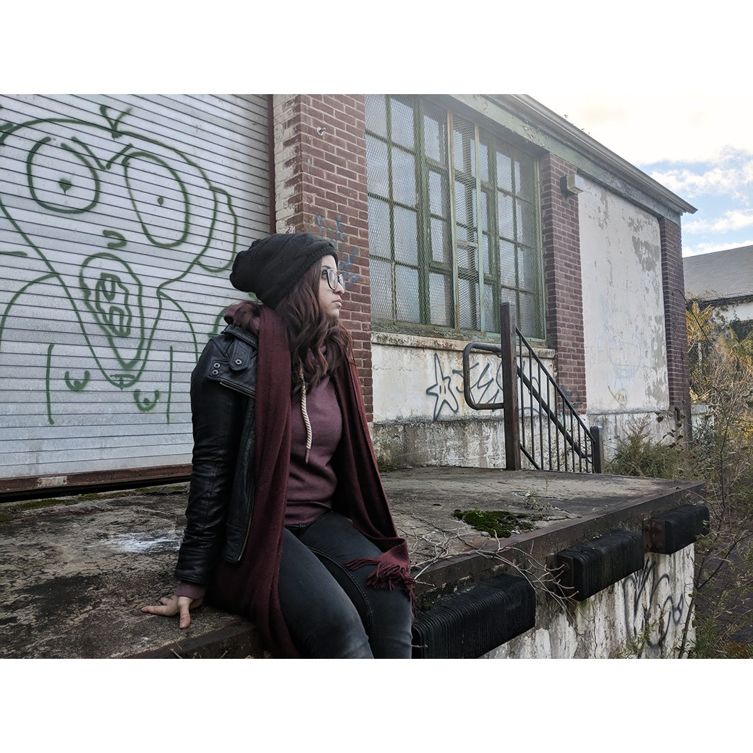 Woman wearing the black plush-lined beanie outdoors