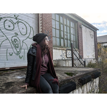 Woman wearing the black plush-lined beanie outdoors