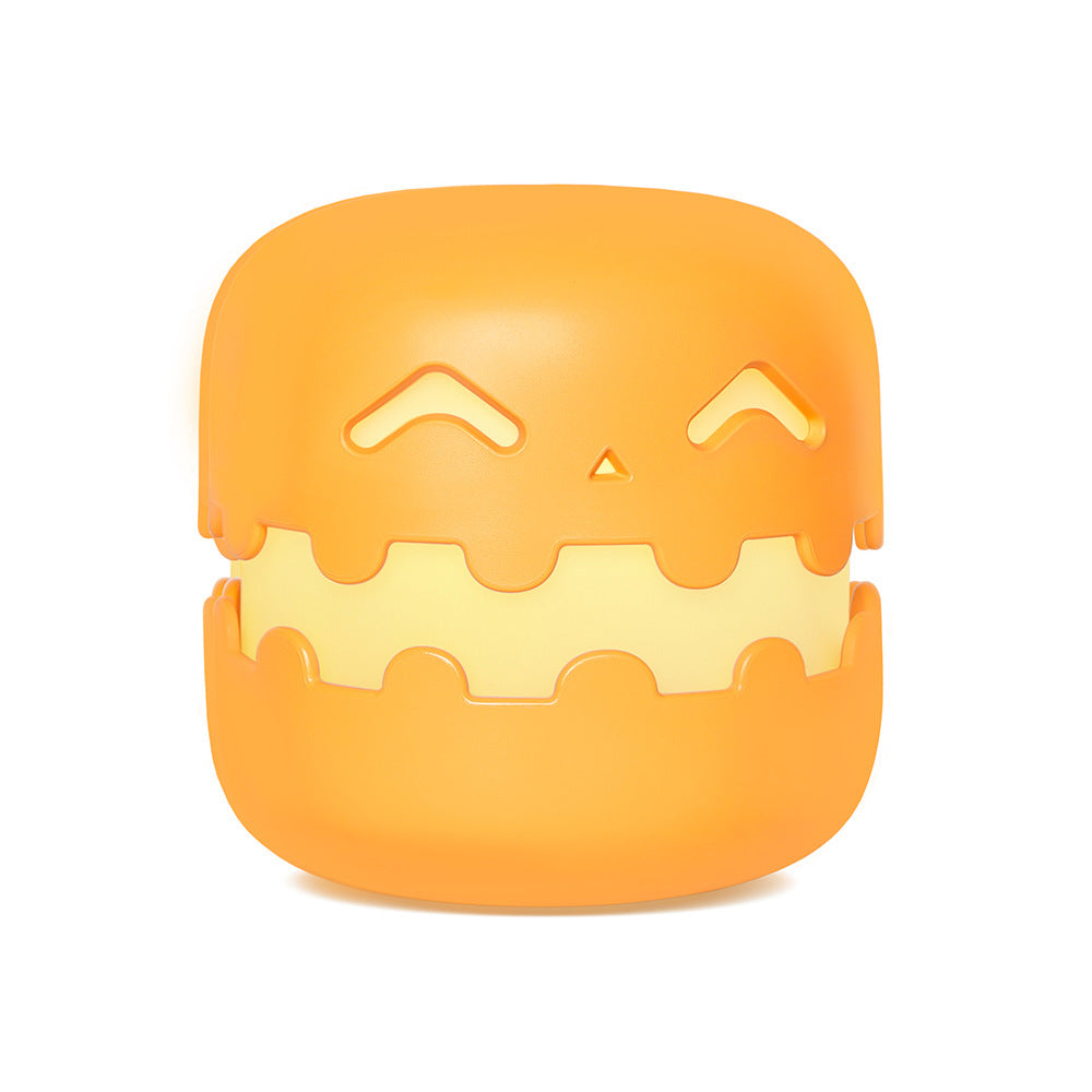 Orange smiling pumpkin silicone night light on white