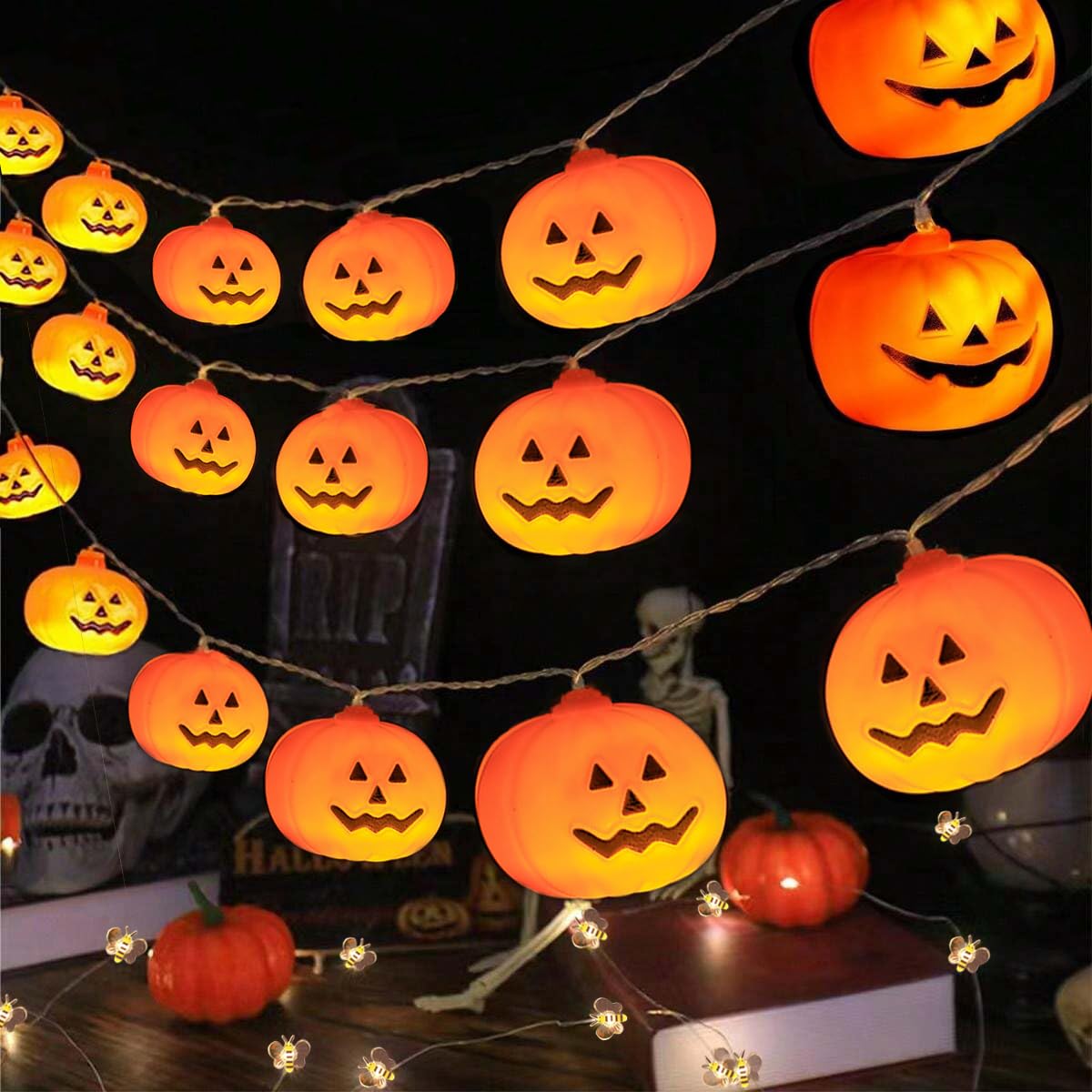 Jack-o-lantern LED string lights glowing on a Halloween table