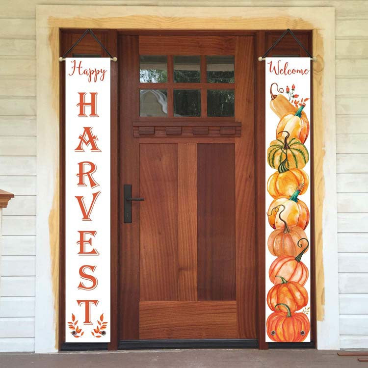 Happy Harvest and Welcome pumpkin porch banners hanging on both sides of a wooden front door