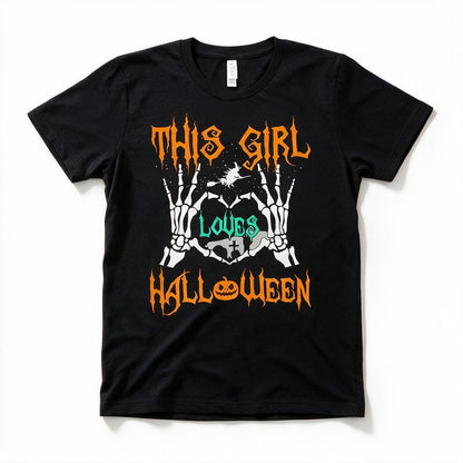 This Girl Loves Halloween t-shirt in black, flat lay on white