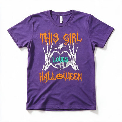This Girl Loves Halloween t-shirt in purple, flat lay on white