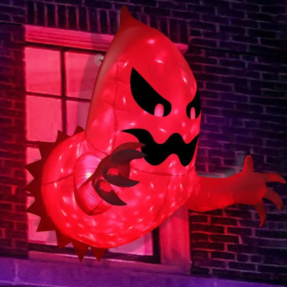 Close-up of the glowing red window breakout ghost inflatable with clawed arms